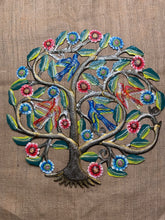 four birds sitting in a tree