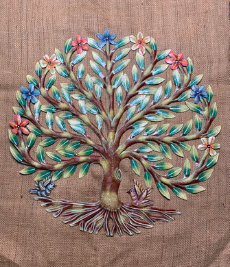 two birds at the bottom of a tree