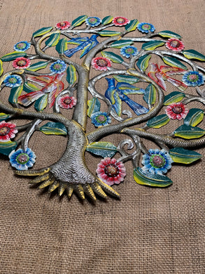 four birds sitting in a tree